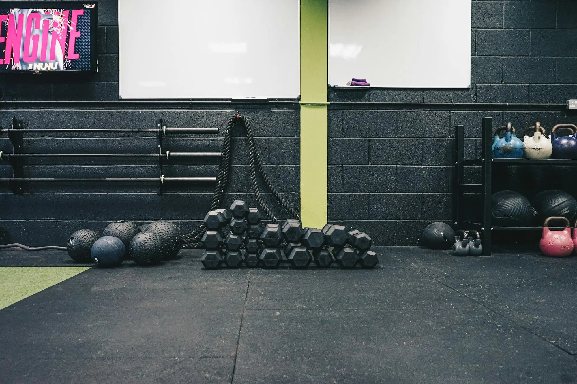 Boutique gym with kettlebells and mats