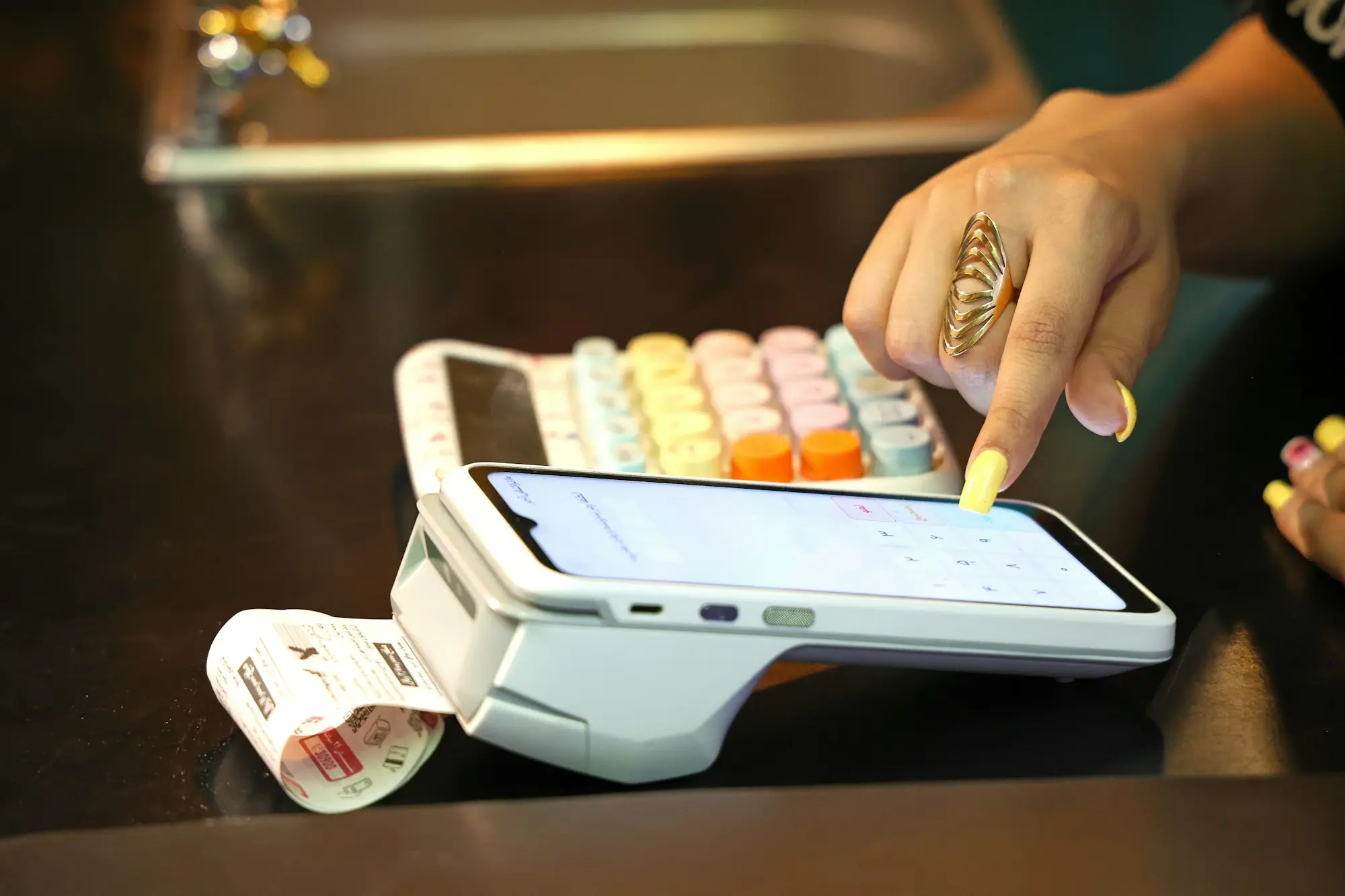 Customer tapping a card on a payment terminal