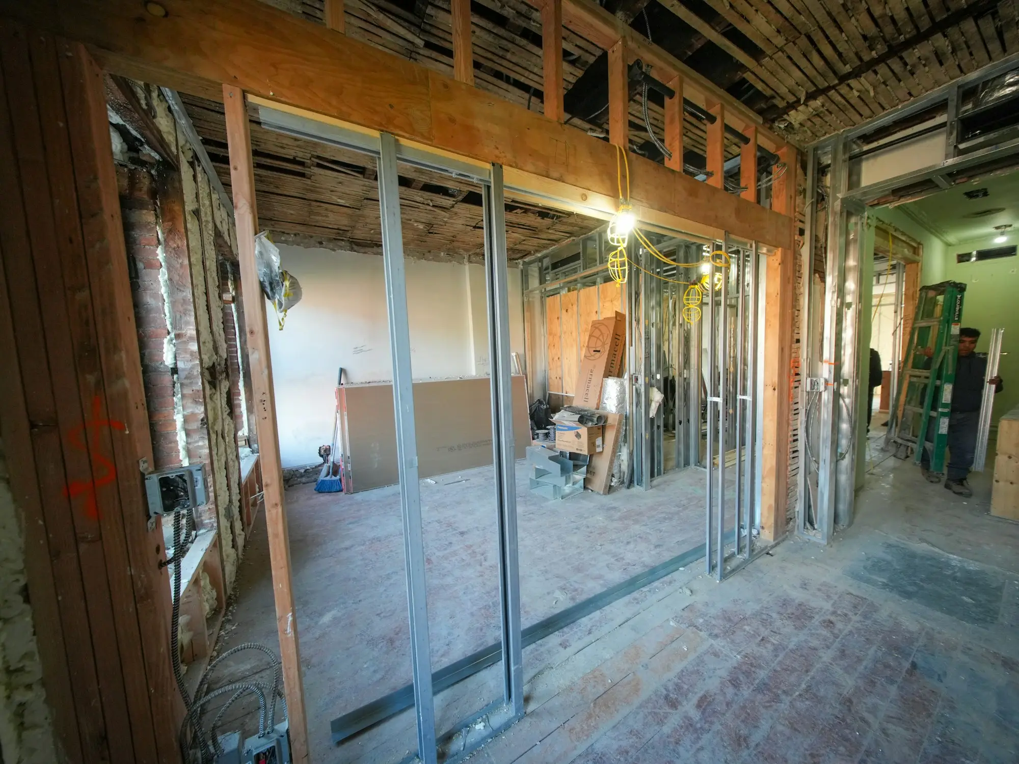 Shop interior mid fit-out with exposed framing